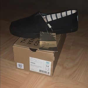 Black Toms with black hard bottom